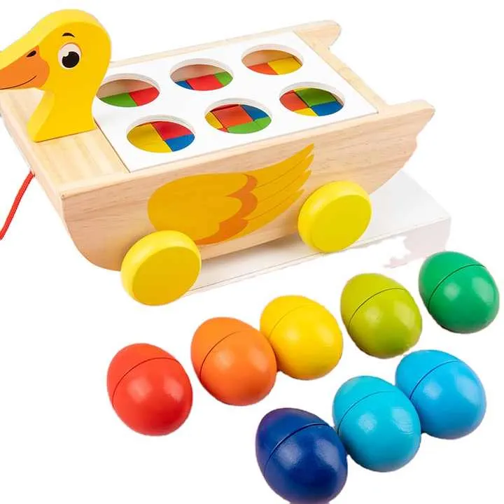 لعبة خشبية ثلاثة في واحد مقطورة بطة مكعب . Three-in-one wooden toy trailer duck cube