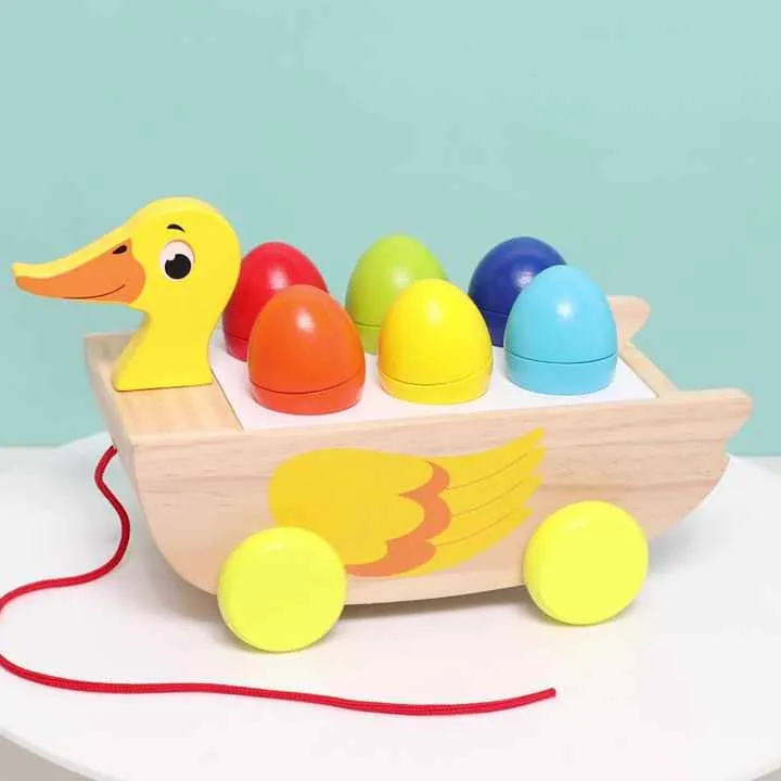 لعبة خشبية ثلاثة في واحد مقطورة بطة مكعب . Three-in-one wooden toy trailer duck cube