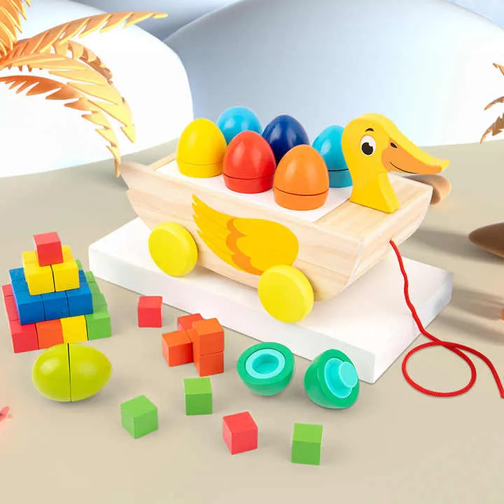 لعبة خشبية ثلاثة في واحد مقطورة بطة مكعب . Three-in-one wooden toy trailer duck cube